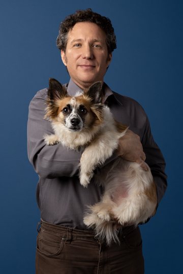Dr. Gary Richter holding a small dog